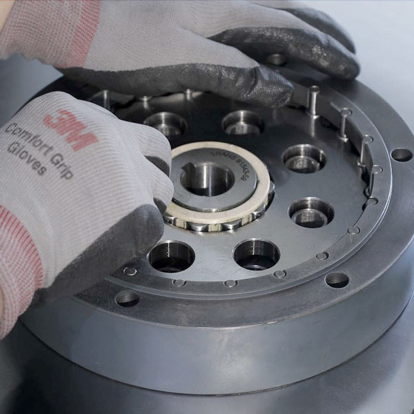 Close up image of a worker assembling a speed reducer gear in the Taiwan speed reducer production facility